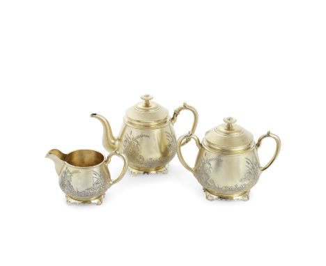 A late 19th century Russian silver-gilt three-piece  tea serviceKarl Fabergé, Moscow 1893, with later Dutch and Swedish impor