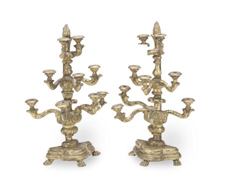 A pair of late 18th / early 19th century Italian carved and giltwood eight light alter candelabrathe foliate scrolling arms w