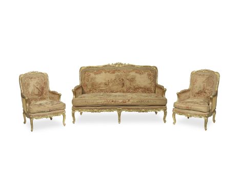 A French late 19th century suite of giltwood seat furniture comprising a canape (sofa) and a pair of bergeresin the early Lou