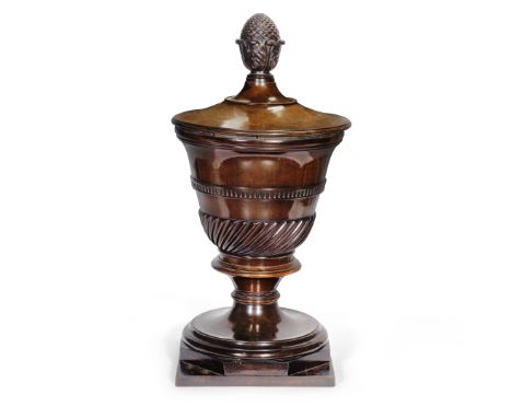 A mid 19th century carved mahogany urn wine coolerprobably originally a dining room pedestal fitting, the urn of pedestal vas