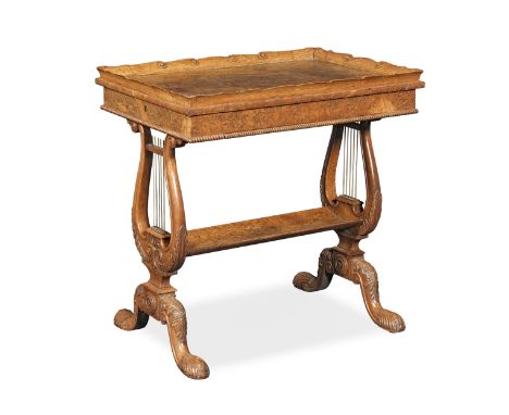 A George IV burr and pollard oak work table attributed to Gillows1822-1825, the waved and everted scroll carved traytop above