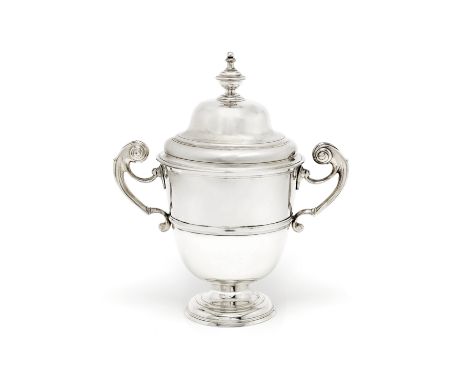 A George III Irish silver two-handled covered cupJohn Laughlin, Dublin 1788 With flying scroll handles, tapered sides with ap