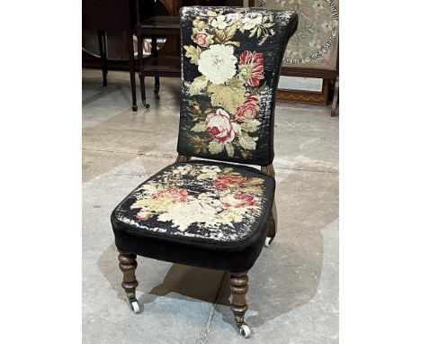 A Victorian tapestry upholstered side chair on ceramic castors