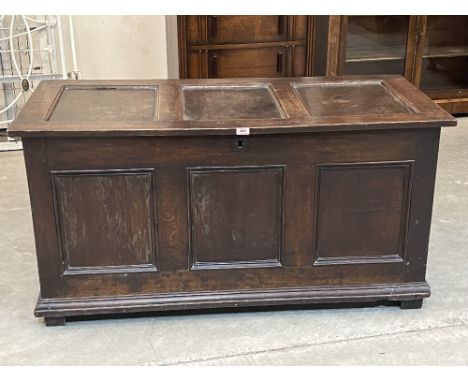 An 18th century joined oak three panel chest, the interior with a till. 51½' wide