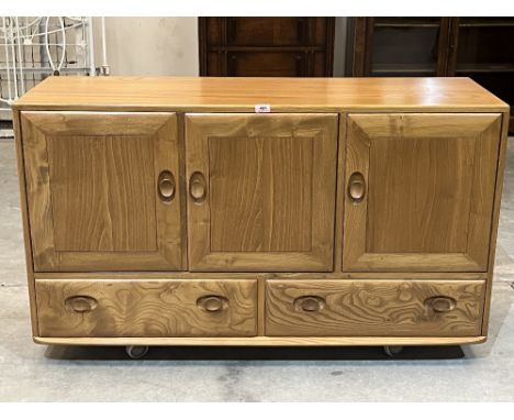 Ercol Furniture. A model 468 blonde elm sideboard. c. 1970. 51' wide