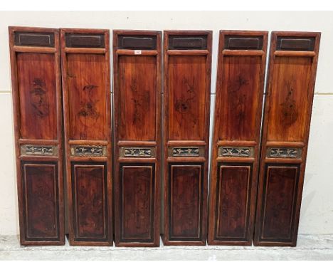 A set of six 19th century Chinese screens, decorated in gold and lacquer with birds in prunus, the upper panels sliding to op