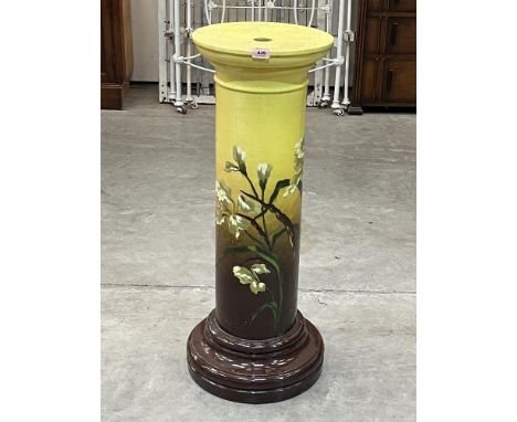 A Victorian Burmantofts Faience jardiniere pedestal, painted with iris flowers on a yellow and brown ground. Impressed marks 