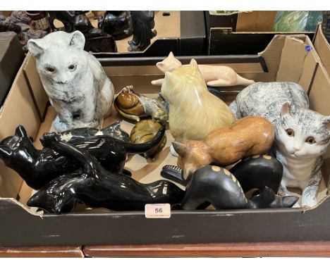 A box of ceramic and wood cats