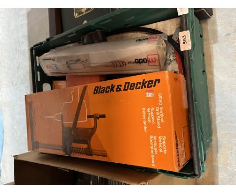 A box of Black + Decker and other tools.