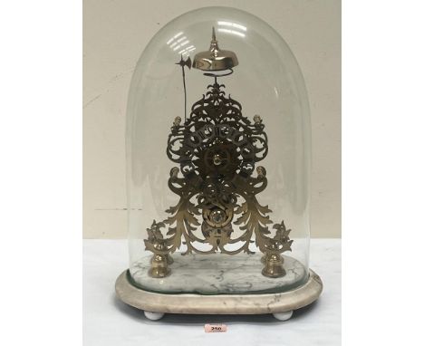 A brass skeleton clock, the fusee movement with passing ting-tang strike, on a carrara marble base under a glass dome. 21½' h