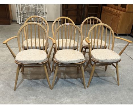 Ercol Furniture. A set of six elm and beechwood chairs, the set to include two carvers 