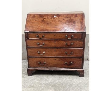 A George III mahogany bureau with fitted interior on bracket feet. 39' wide