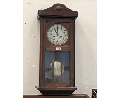 A 1930s wall clock with two train movement. 29' high