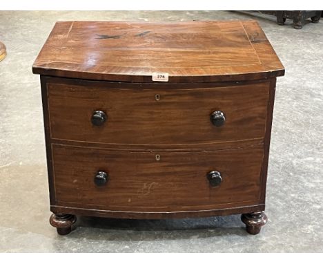 A 19th century mahogany bow-fronted chest with two blind drawers. Formerly a commode. 24' wide