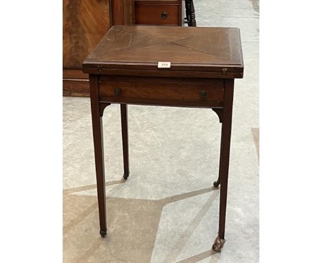 An Edward VII mahogany envelope card table. Castor A.F.