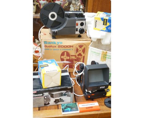 Sankyo dualux 200H super 8 projector together with a televideo producer and others to include screen