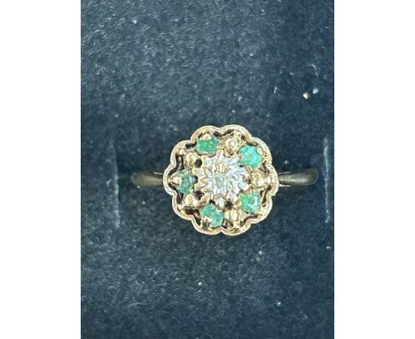 9ct Gold cluster ring set with emeralds surrounded by  central diamond Size K 