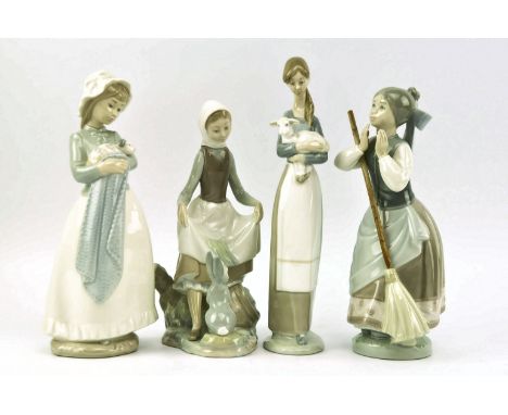 A collection of four vintage Lladro &amp; Nao porcelain figurines. Comprising Rabbit Food 4826, a girl holding a puppy, Girl 