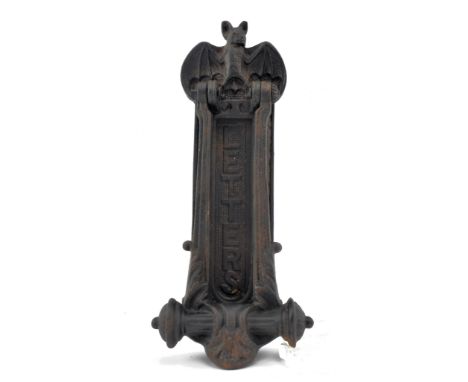 A Victorian 19th century style cast iron letter box and door knocker in Gothic style. 'Letters' to the central spring flap, w
