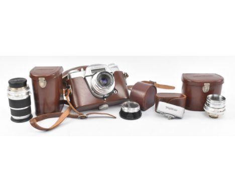 Vintage cameras. A mid century Voightlander Bessamatic camera in original leather case, complete with cased Compur, Skoparex,