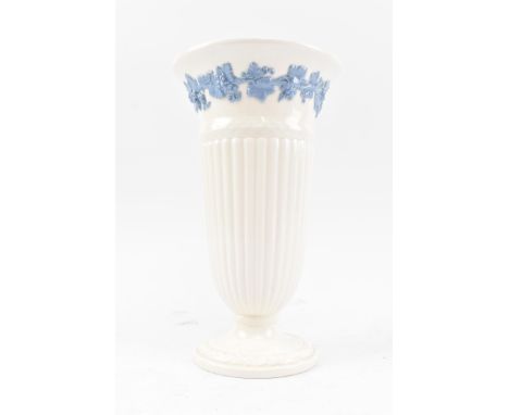 Wedgwood - Eturia - a vintage 20th century ceramic vase. The vase having a flared rim and flutted body with blue highlight fl