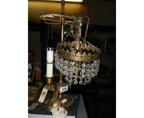 An early 20th century double brass table lamp and a glass ceiling light. 