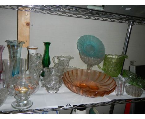 A shelf of glass ware. 