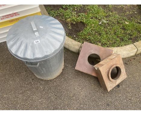 A metal bin and 2 ceramic drain covers 
