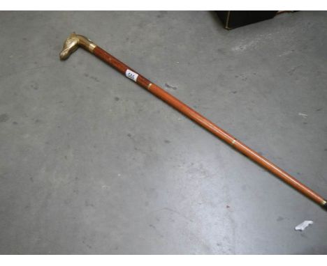 A three piece walking stick with brass horse head handle. 