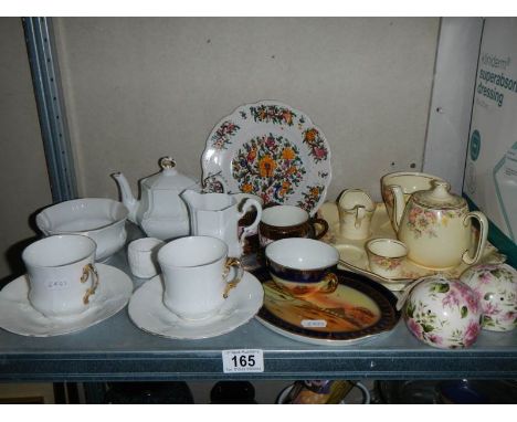 A shelf of ceramics including Noritake. 