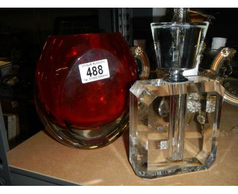A glass perfume bottle and another item of glass. 