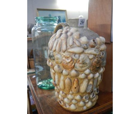 An E C Davies, Gainsborough 1 gall stoneware flagon decorated with shells and a lidded glass jar. 