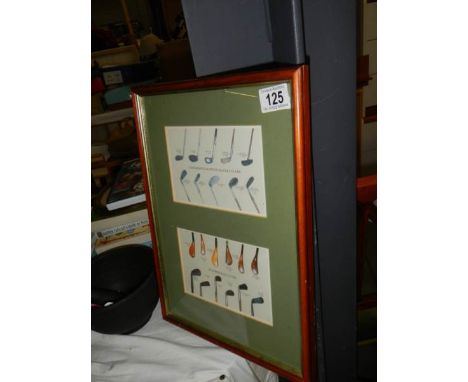 A framed and glazed print of golf clubs. 