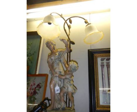 A figural two light table lamp. COLLECT ONLY. 