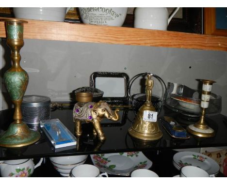 A mixed lot of metalware including brass bell, elephant, candlestick etc., 