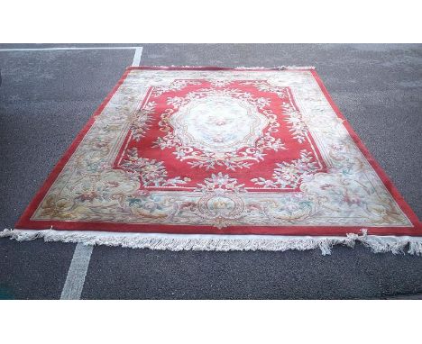 A 8ft x 10ft 100% pure wool, good quality red carpet (in need of a clean) 