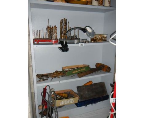 Three shelves of old tools. 