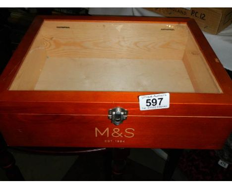 An M &amp; S glazed display case. 