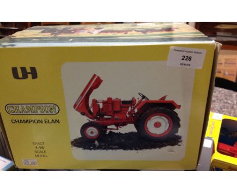 A boxed Universal Hobbies 1:16 scale Champion Elan tractor