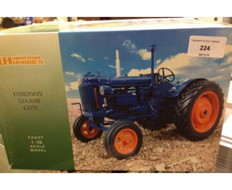 A boxed Universal Hobbies 1:16 scale Fordson Major E27N tractor as found, exhaust broken off
