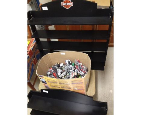 A box of Maisto Harley Davidson motor cycles with 2 wall display shelves, one with Harley Davidson logo