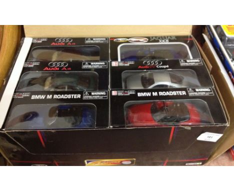 A trade box of 12 1:32 scale diecast sports cars.