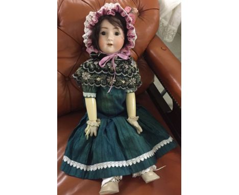 25" bisque head doll marked A 10 H Germany. Modern composition body. Dressed for display.
