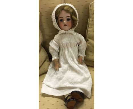 A 22" antique bisque head doll by Simon & Halbig -,back of head marked 1079 S & H DEP Germany 11. Has a jointed composition b