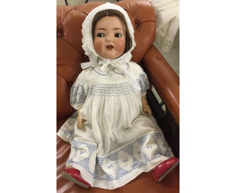 26" bisque head baby doll by Heuback Koppelsdorf marked 342.12 Germany. Composition body, finger missing. C1920s.
