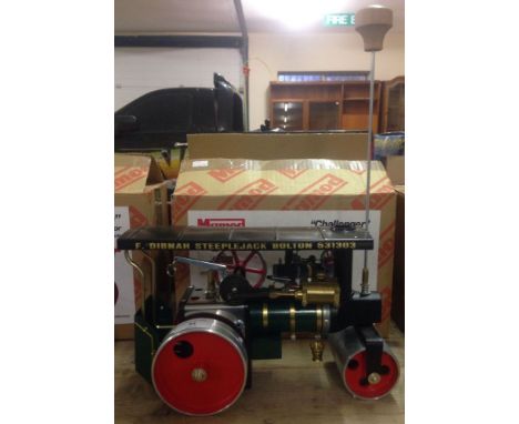 A boxed Mamod 'Challenger' steam roller live steam engine with double action piston cylinder. Green body and black roof with 