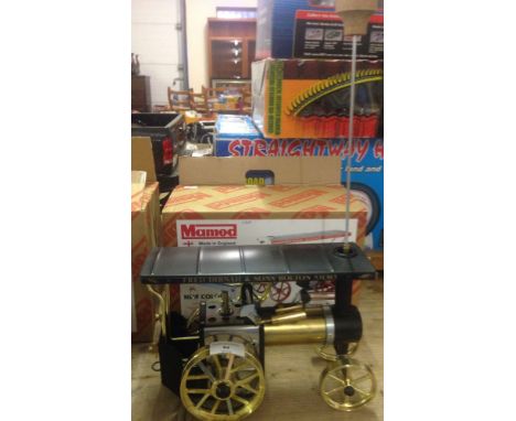 A boxed Mamod TE1A steam tractor live steam engine with brass body and black roof with Fred Dibnah logo. Appears unused.