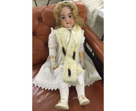 32" bisque head doll by Simon & Halbig. Marked 1079 Germany Halbig S & H 15. Dressed in mostly period clothing with real fur 