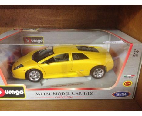 A boxed Bburago 1:18 scale yellow Lamborghini Murcielago - mint in box.