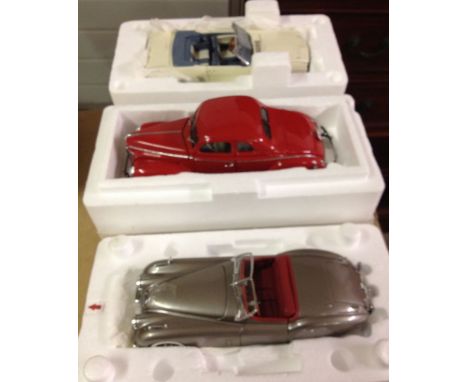 3 boxed Danbury Mint 1:24 scale cars: 1) 1949 jaguar XK120. 2) 1940 Ford Deluxe Coupe and 3) 1966 Ford Mustang. N.B. Jaguar h